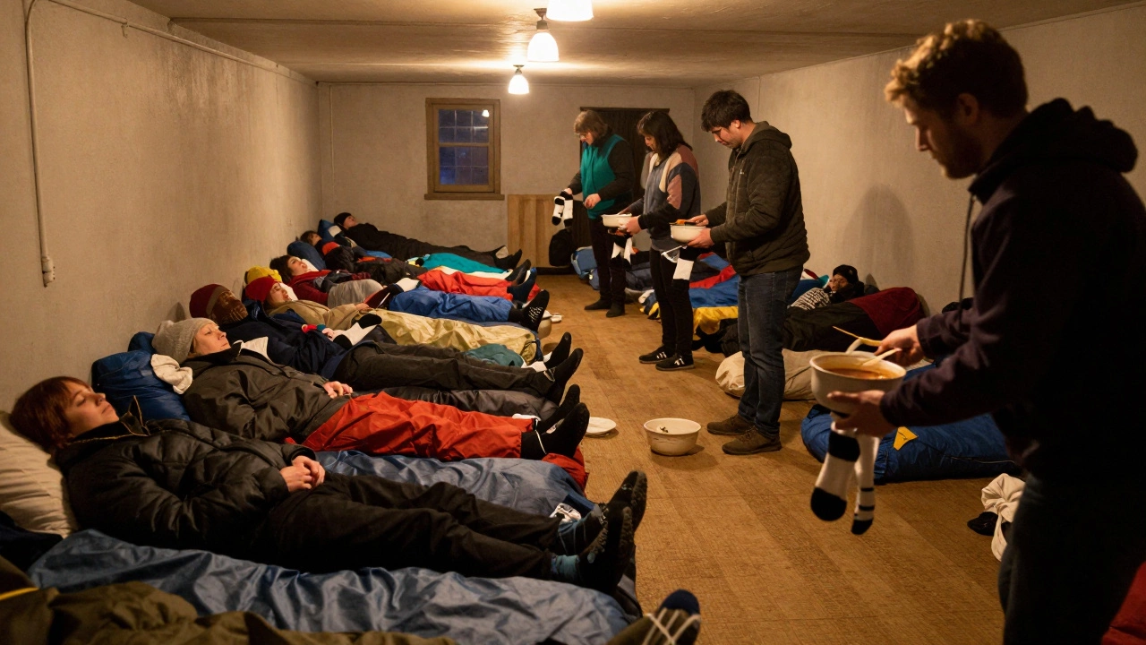 Volunteers serving soup to people sleeping on the floor in a church basement during a cold weather shelter night.