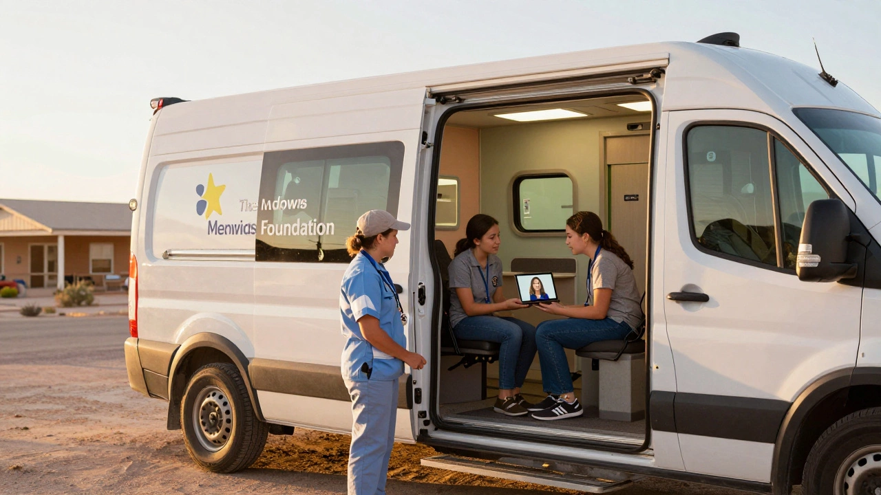 A mobile mental health unit outside a rural Texas clinic, with a therapist conducting a video session via tablet.